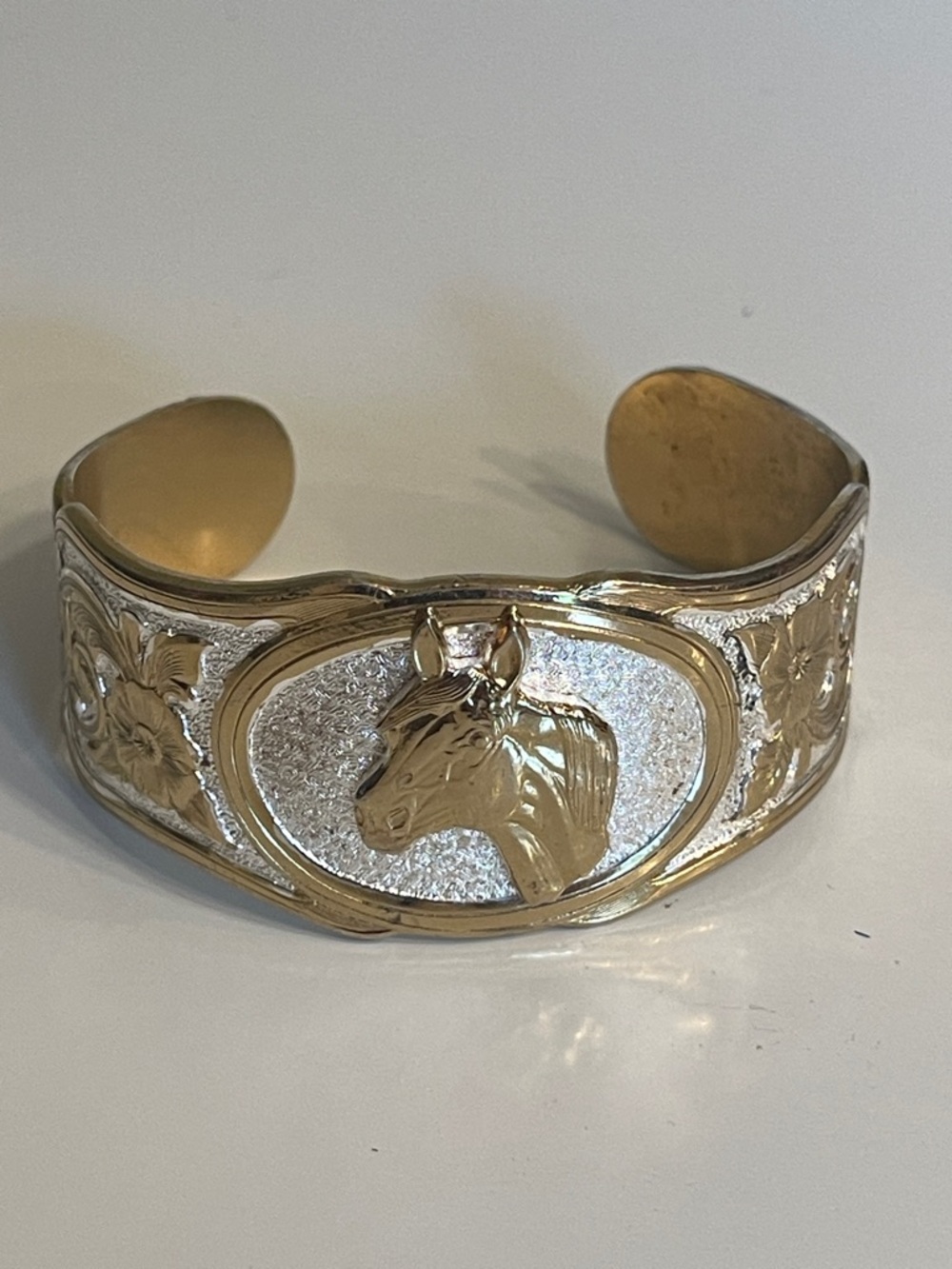 Montana Silversmiths Texas Cuff Horse 
Bracelet. Silver & Gold Tones
